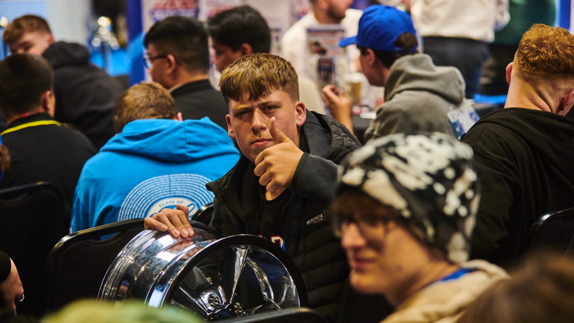 Young man gives his thumbs up at Automechanika Birmingham 2025